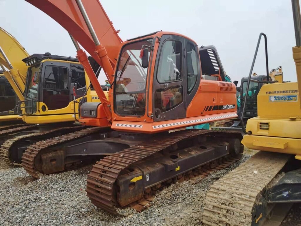 The Doosan DX260 Excavator is a robust machine known for its performance and reliability in the construction and mining industries. Here are some key features and specifications typically associated with the Doosan DX260: Engine: Powered by a diesel engine that meets emission standards, providing high horsepower and torque for efficient operation. Hydraulics: Advanced hydraulic system with precise control for smooth operation of the boom, arm, and bucket. Cab: Spacious and comfortable operator cab with ergonomic controls, air conditioning, and excellent visibility. Performance: Known for its digging force, lifting capacity, and overall performance in various soil and terrain conditions. Safety: Equipped with safety features such as ROPS (Roll Over Protective Structure) and FOPS (Falling Object Protective Structure) to ensure operator safety. Attachments: Compatible with a range of attachments for versatility in different job sites and applications. Maintenance: Designed for easy maintenance access points to minimize downtime and maximize productivity. The Doosan DX260 is typically used for tasks such as excavation, trenching, loading, and material handling on construction sites and in mining operations. It's valued for its durability, efficiency, and operator comfort, making it a popular choice among contractors and operators alike.